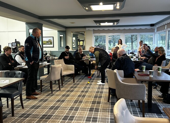 Fun indoor golf competition at DBN networking meeting.