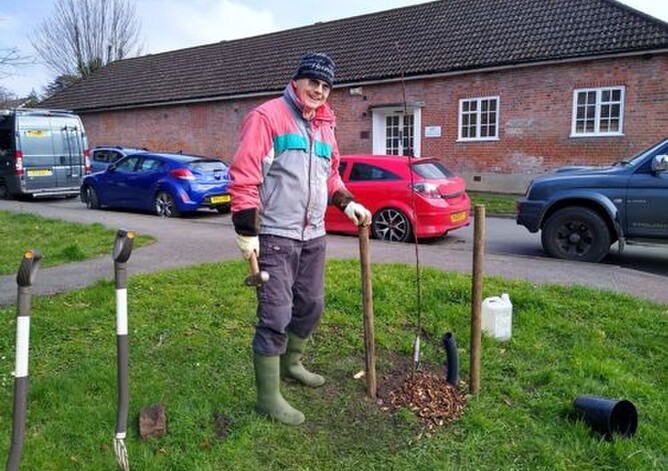Brian Williams helped the Bookham Tree Wardens plant the five  new heritage apple trees at Lower Shott.
