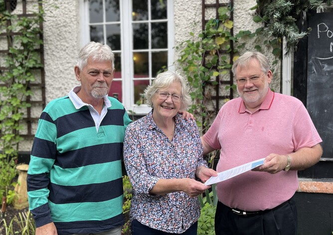 Tony Mann, Quiz Night organiser; Debbie Bancroft, manager of The Anchor with Simon Edge, BRA Vice-Chairman