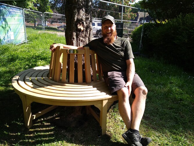 Bookham resident Sam Dickinson tests out the newly installed bench!