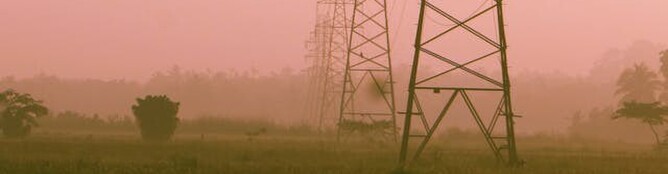 Electricity pilons on a red sunset background
