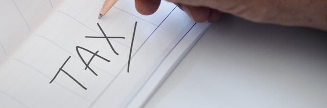 Pen writing 'tax'