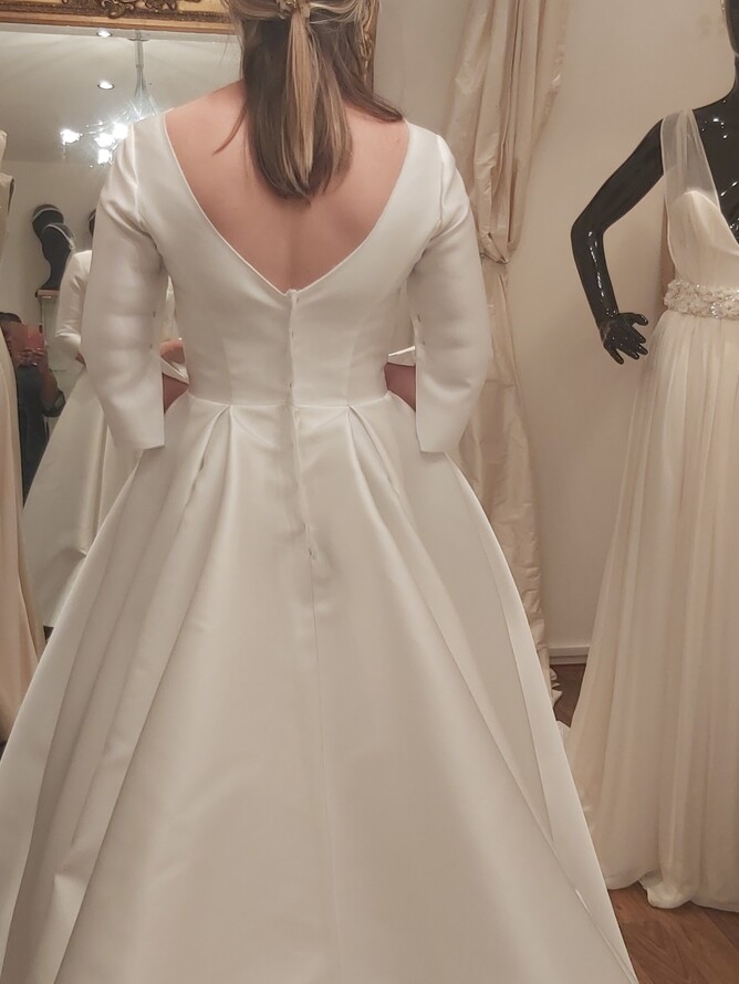 Back profile view of our bride during her shell wedding dress fitting in our West London Bridal Atelier in Acton