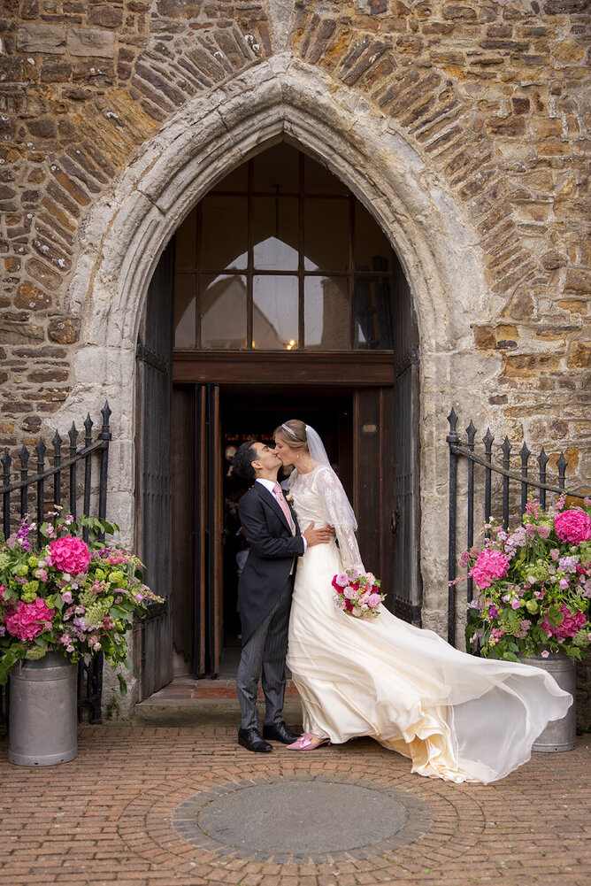 Bride in custom wedding dress designed for elegance and movement, By Kate Edmondson