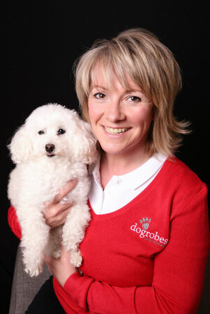 Margaret Reynolds, owner of DogRobes with Missie