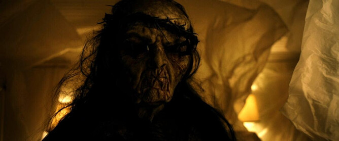 A terrifying image from 'I WILL NEVER LEAVE YOU ALONE,' featuring a ghostly figure emerging from the shadows, capturing the haunting atmosphere of the film.