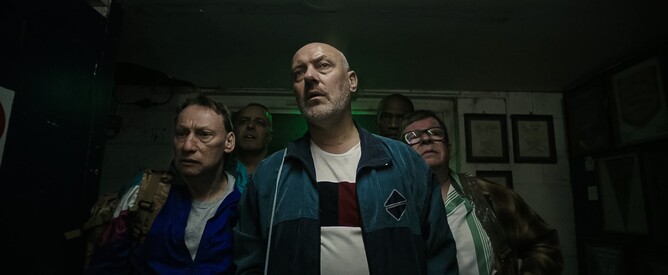 The 'Wet Dreams' stripper group looks concerned as they uncover a dark plot in 'MEMBERS CLUB,' a British comedy horror directed by Marc Coleman.