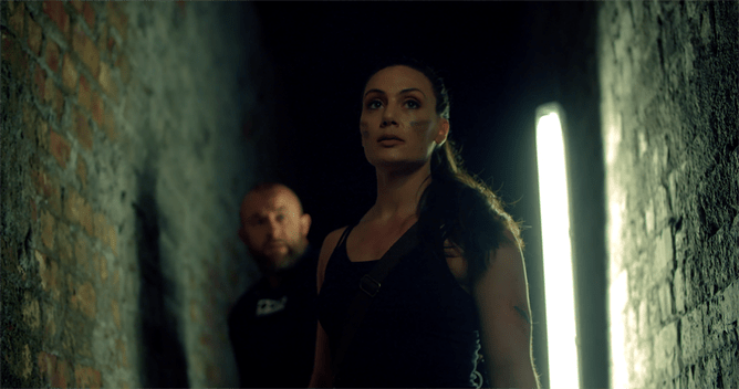 Trailer Drops For Matt Routledge's Brutal Action Horror TRIBAL - GET OUT ALIVE. starring Zara Phythian