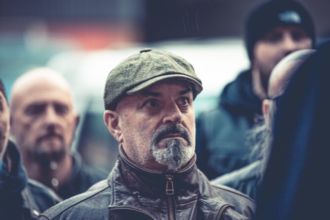 Shaun Ryder and Bez filming a chaotic gangland scene in 'GEEZERS'.