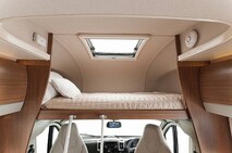 large king bed, over cab with curtains