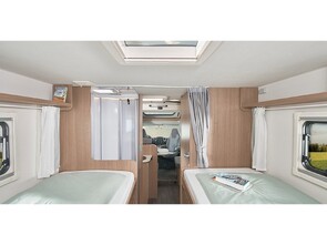 2x rear single beds, or can have a large king