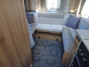 veiw of rear lounge, with 3x windows, with drop down bed above.