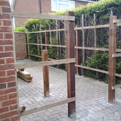 Closeboard framework installed with timber posts and cant rails