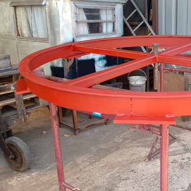 Image shows the old metal castor ring welded to to new metal base plates and fully painted with red oxide primer.