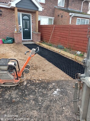 Gravel rings laid over hardcore base, awaiting stone infill.