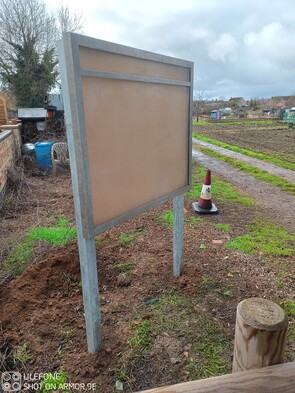 Image shows an allotment notice board installed on galvanised Durapost end posts. Set into concrete foundations, the metal posts mean no rotting wood and ensures a long lifespan with minimal maintenance.