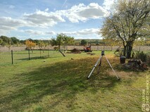 Image shows a lawn with first excavtion for the summer house base. This is all part of a larger garden landscaping project near Bedford.