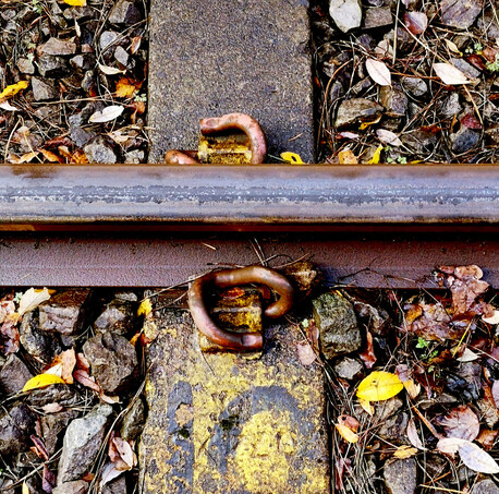 rail track before it is cleaned using PlasmaTrack rail cleaning system. The black teflon like residue is from compressed dried leaves