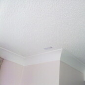 Asbestos containing decorative coating