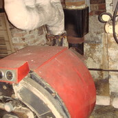 Asbestos insulation to pipe work within a boiler room