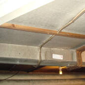 Asbestos cement sheets to a ceiling