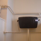 Asbestos containing toilet cistern