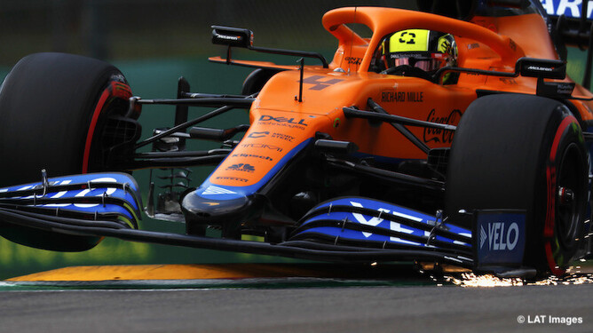 McLaren F1 car riding the kerbs