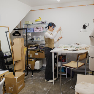 Patter cutter, Mina Zhao working at her studio - the 'Classic' studio. Size ranges from 140 - 180 sqft.
