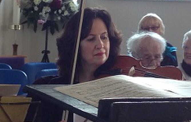 Jane Cordell playing viola with the Ramsbottom orchestra.